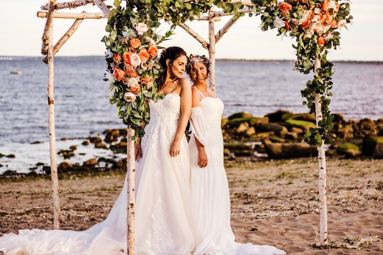 Bride-and-Bride-under-floral-arbor